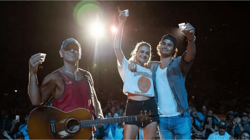 Chase Stokes Joins Kelsea Ballerini on Stage for a Shot to Celebrate Final Shows with Kenny Chesney